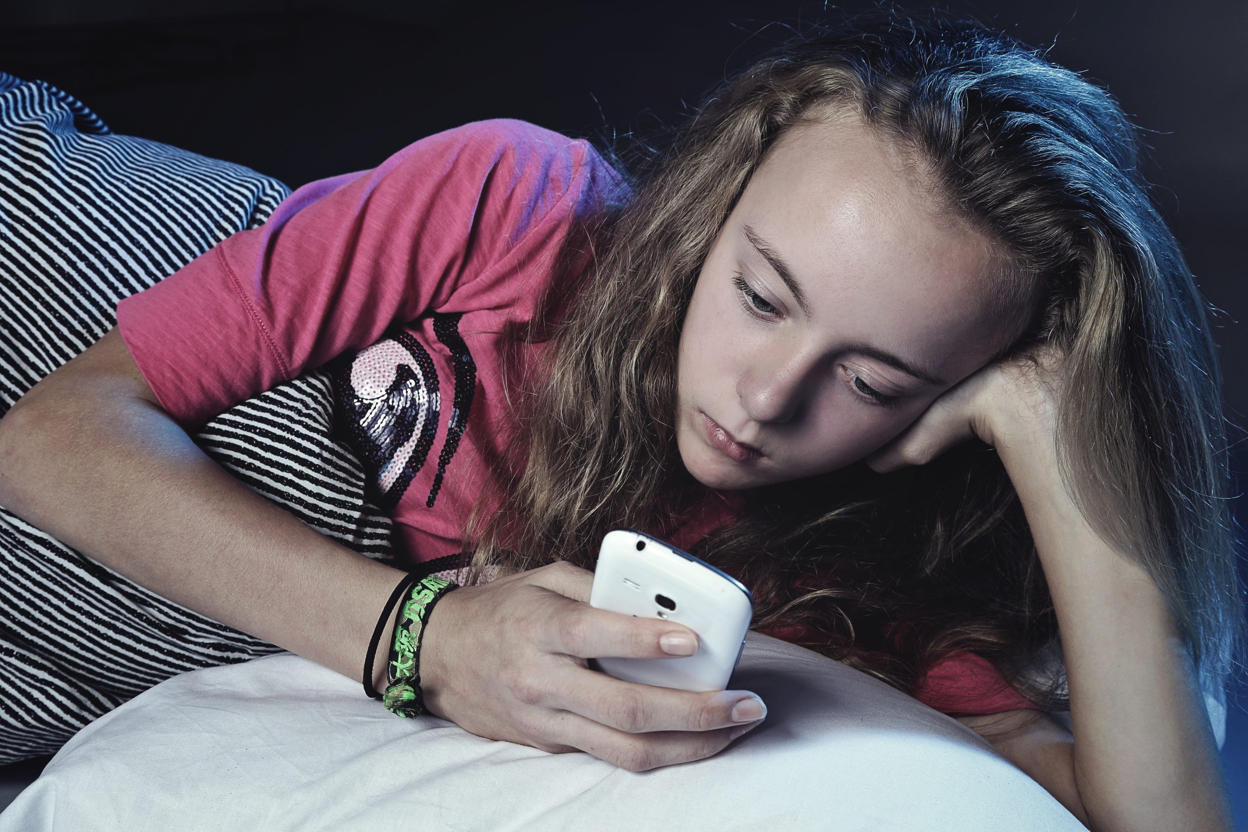 teen_phone_bed - Alaska Sleep Clinic - Alaska Sleep Clinic